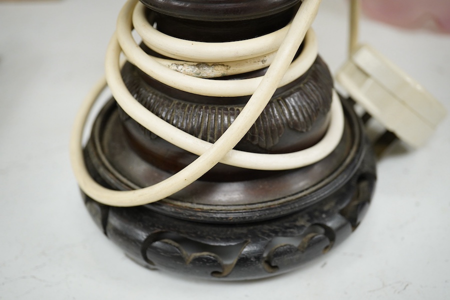 A Japanese bronze vase, converted to a lamp on carved wooden stand, 34.5cm high not including fitting. Condition - drilled to base